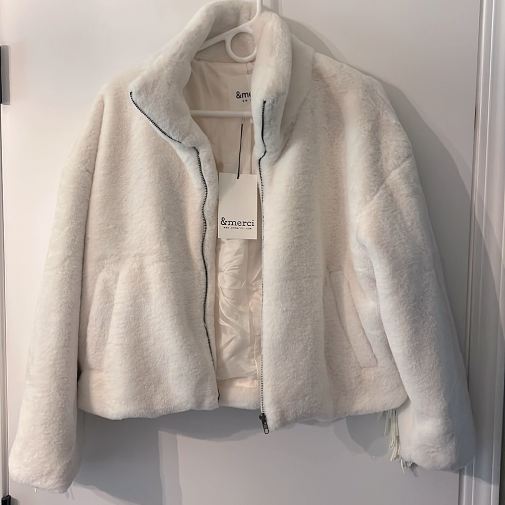 Boutique fleece with fringe.